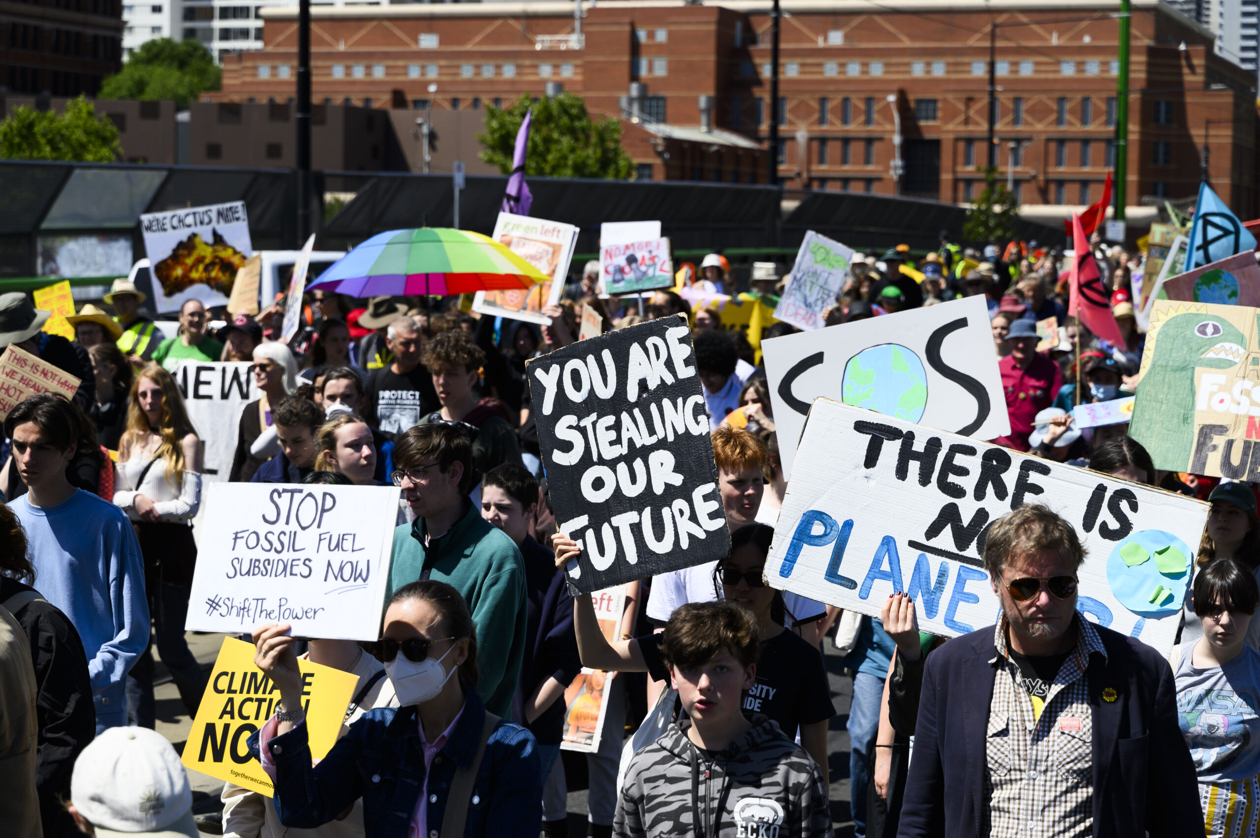 People at the School Strike for Climate holding signs with slogans in favour of climate action